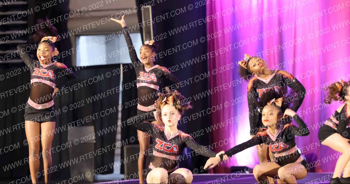 Zachary Cheer Athletics Fire · The American Coastal