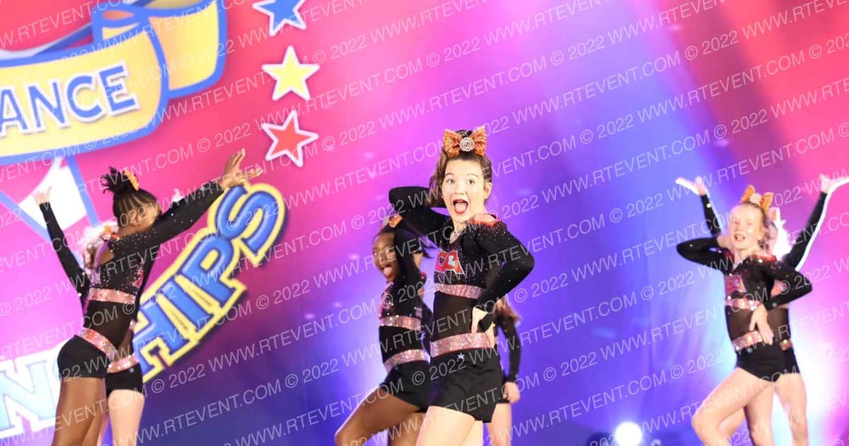 Zachary Cheer Athletics Fire · The American Coastal