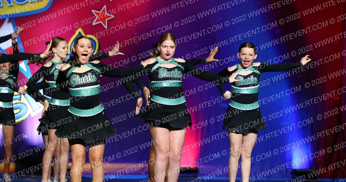 Cheer Sport Sharks-New England Teal Reef Sharks · The American Legacy Springfield Nationals